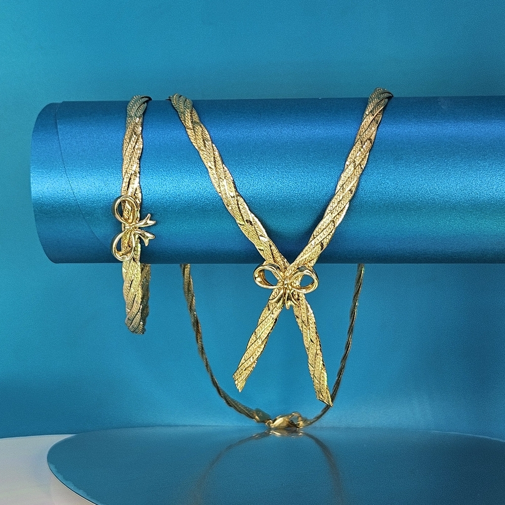 Triple woven herringbone bow necklace and bracelet diamond cut